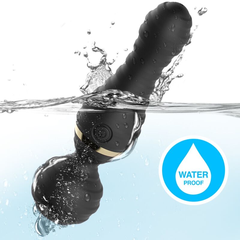 Vibromasseur wand Freedo noir d'Armony plongé dans l'eau, pictogramme étanche