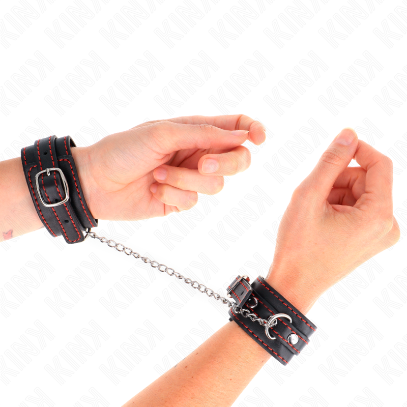 Small black wrist restraints with red lining adjustable 14-24 cm x 3.5 cm