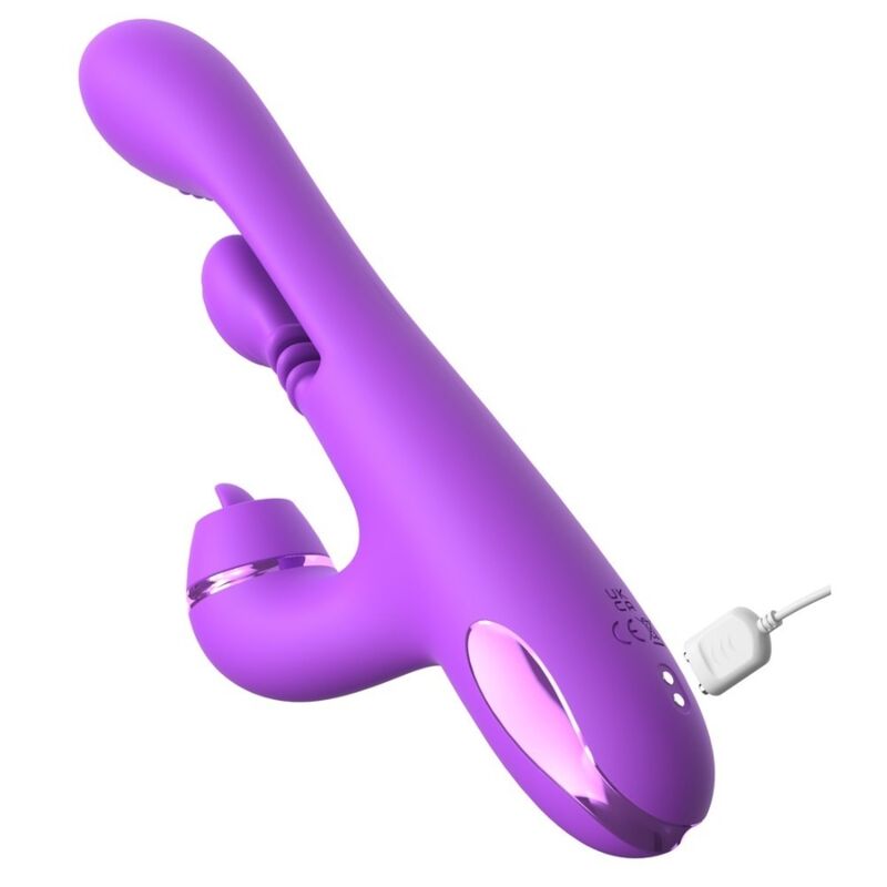 Rabbit Pulse Pro violet de Fantasy couché, câble de recharge branché à la base